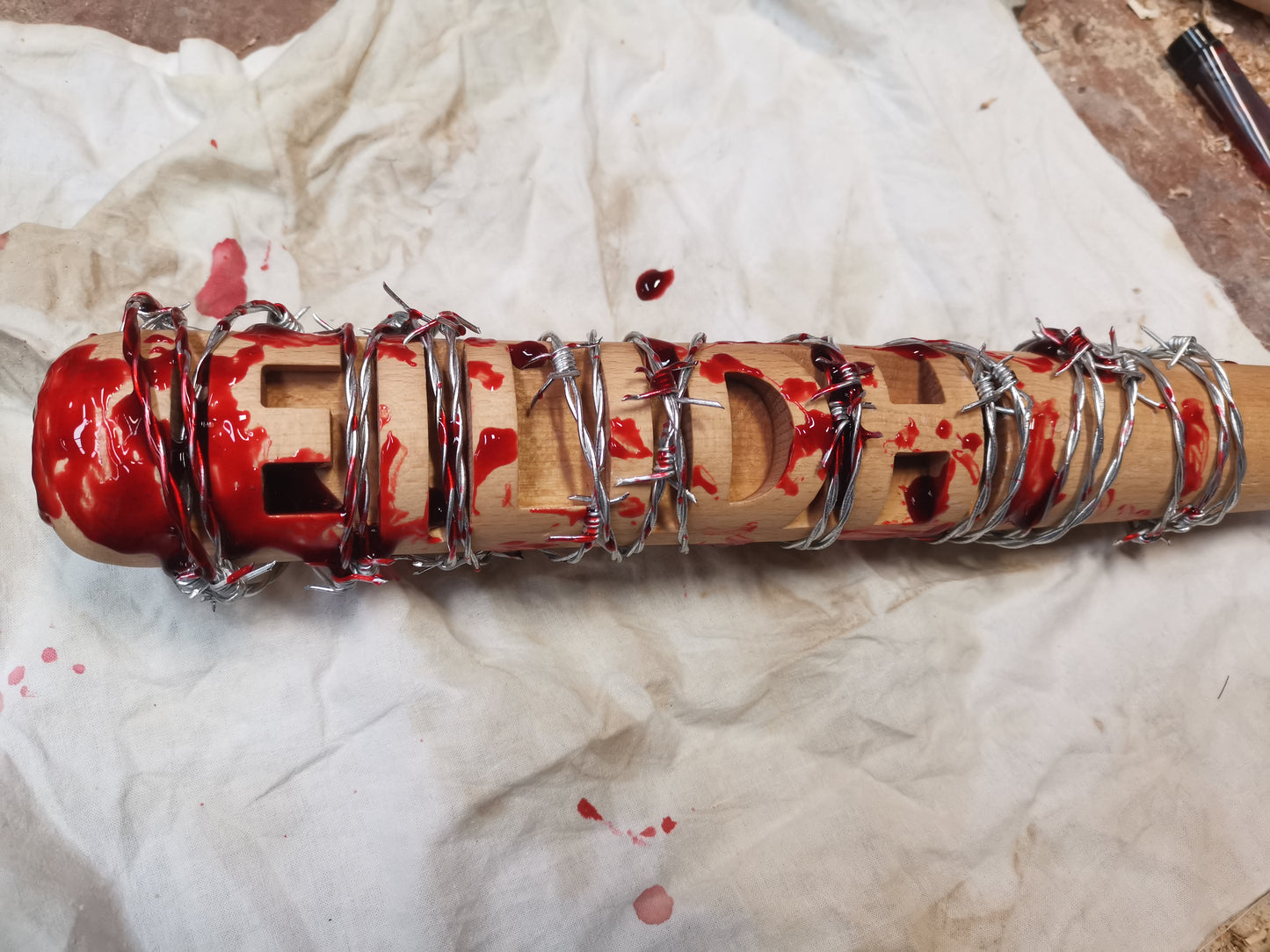 addition of carved text to Lucille bat